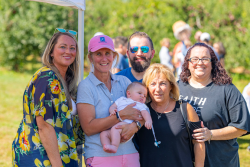 Eastern Produce Council executive director Susan McAleavey Sarlund holds 3-month-old Joseph Michael DeLorenzo and is surrounded by his family:  father Anthony DeLorenzo, aunts Deanna and Christina, and grandmother Goldie.
