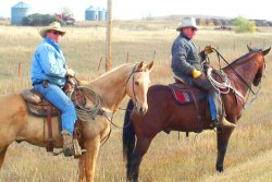Jared Schott, left, picture with his father, Jim, is equal parts farmer, rancher and tech cowboy.