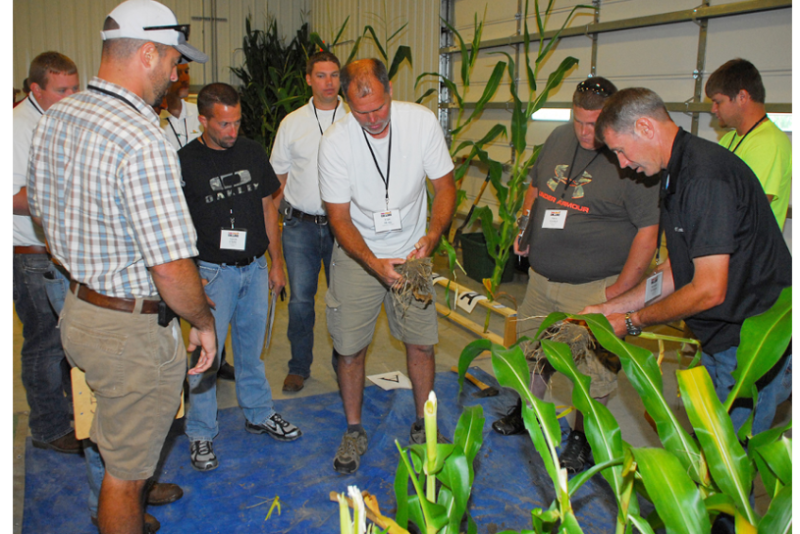 Farmers get hands-on information, both in the field and in the classroom.