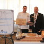Ohio Pork Council President Dave Shoup presents Chef Aaron Braun with the Chef Par Excellence Award and People's Choice Award. Braun has been awarded the People's Choice Award for two consecutive years.

