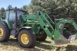 This John Deere 7210 w/ 4200 hours and loader sold for $88,000 on an Oct. 1, 2022 farm auction 