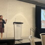 woman talking on stage