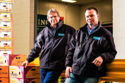   John Vena and Dan Vena lead a century anniversary at their store at the Philadelphia Wholesale Produce Market.