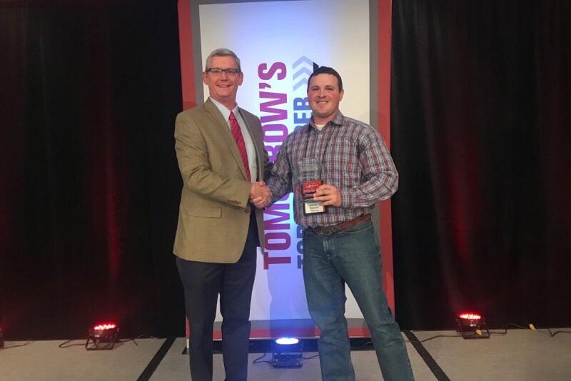 Mark Timke, national strategic account manager for Pioneer (left), congratulates Anthony Schwarck of Schwarck Farms in Riceville, Iowa, for being named the 2019 Tomorrow’s Top Producer Horizon Award winner at Farm Journal Media’s Top Producer Seminar in Chicago.