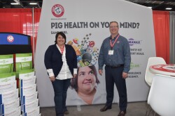 Ellen Davis, ARM & HAMMER swine technical services manager, (left) and Steve Larsen, Passport Food Safety Solutions, (right) welcome attendees of the Iowa Pork Congress.