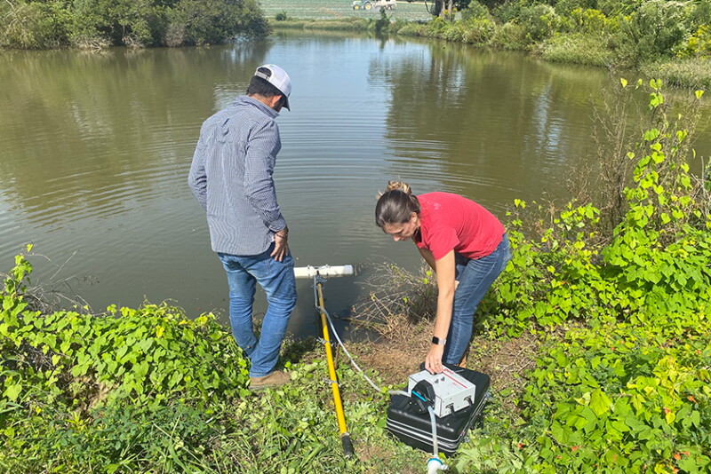 Two people conducting research in ag water