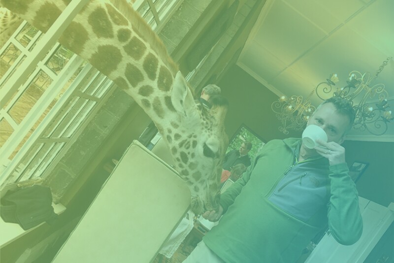 Kevin Moffitt, president and CEO of Pear Bureau Northwest, pictured here with a giraffe on his world travels, shares the opportunity the produce industry should take advantage of, his most memorable project and what new skill we should try.