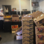 Peter Resteghini (right), buys and sells mostly berries and melons for 4M Fruit Distributors at the New England Produce Center.