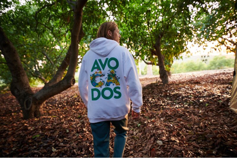 A hoodie from the Commission’s merchandise shop, photographed in a grove. 