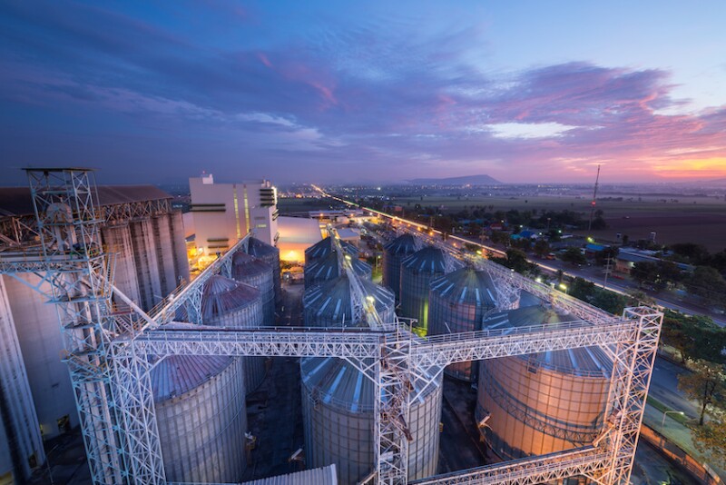 Feedmill Grain Bins Sunset_Adobe Stock