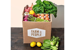 cardboard box with vegetables and eggs