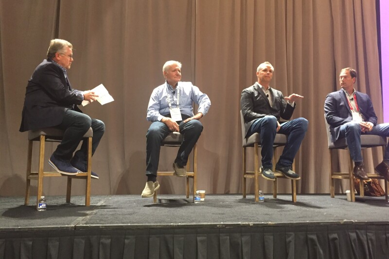 Dan Bourgault (second from right) said if Instacart product isn’t making cooking more convenient for consumers, it fails. He was part of a panel on e-commerce at the Organic Produce Summit. Morning News Beat’s Kevin Coupe moderated (from left) and was joined by Tony Stallone of Peapod; Bourgault; and Don Barnett of Sun Basket.