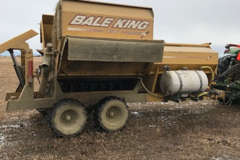 This bale processor, modified with a spray system for applying liquid supplement, allows a rancher to feed a measured dose of Rumensin to gestating cows.

