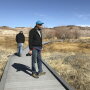 Len Warren, right, and John Zablocki from the The Nature Conservancy stand on the boardwalk at the Torrance Ranch Preserve north of Beatty, Nevada on Feb. 8, 2019. 