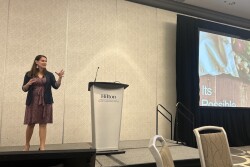 woman talking on stage