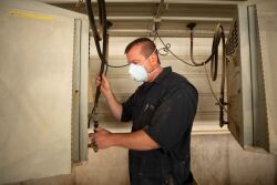 Caretaker checking heater