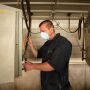 Caretaker checking heater