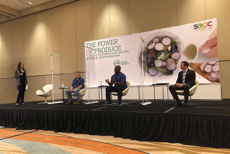 Anne-Marie Roerink of 210 Analytics discusses the findings in the new Power of Produce report with Mike Roberts of Harps Food Stores (left), Gary Baker of Merchants Distributors (middle) and Price Mabry of HAC (right).