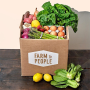 cardboard box with vegetables and eggs