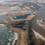 As waters recede from the thousands of acres that were flooded this spring, attention turns to spring planting. If those acres are rented, who will pay for the cleanup? Should the rental rate be adjusted? 