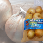 A consumer bag of onions from Little Bear Produce
