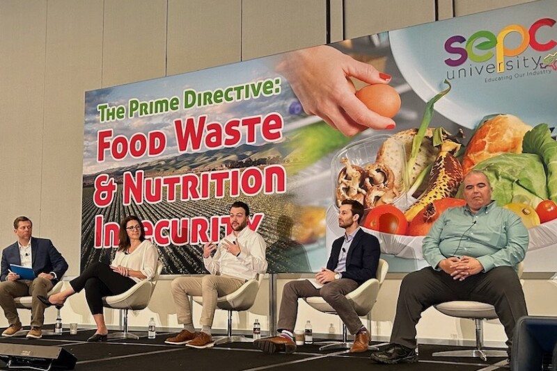 five people on a panel stage