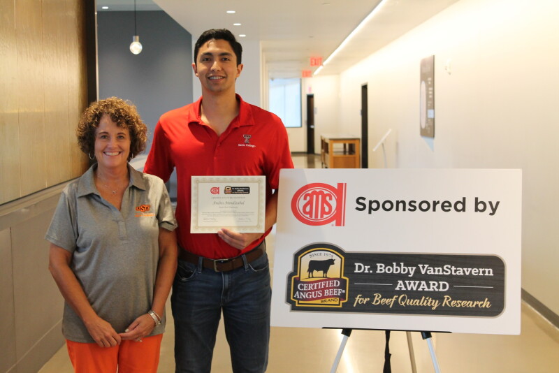 Gretchen Mafi, president of the American Meat Science Association, presented Andres Mendizabal the Dr. Bobby VanStavern Award during the Reciprocal Meats Conference.