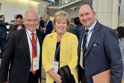 Three individuals stand together: FMI President and CEO Leslie Sarasin at the White House Conference. She is joined by Kroger CEO Rodney McMullen (left) and Hy-Vee Chairman Randy Edeker (right)