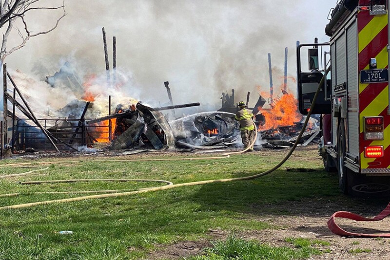 Firefighter fighting barn fire
