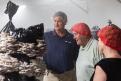 Pete Gray (from left), grower manager at Phillips Mushroom Farms, Kennett Square, Pa., takes Agriculture Secretary Sonny Perdue and U.S. Rep. Chrissy Houlahan (D-Pa.), on a tour of the companies facilities on May 30. 

