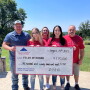Pictured in the check presentation photo: