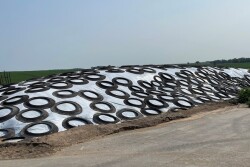 Pictured above is haylage pile that has been properly covered with tires touching, good slop and a sand berm around the base to hold it down and redirect water around the pile when it rains.