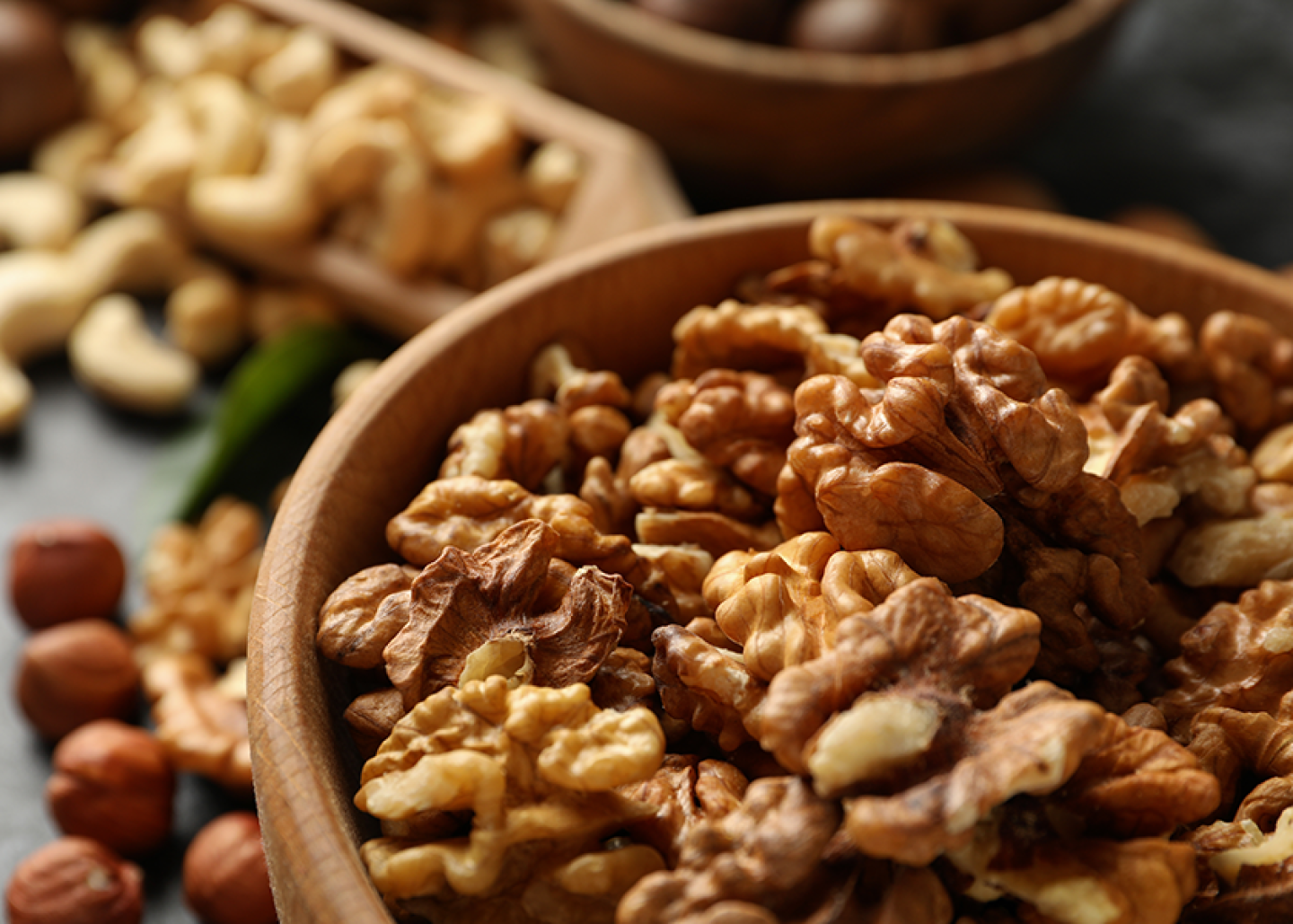 Shelled walnuts in a wooden bowl