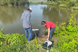 Two people conducting research in ag water