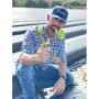 Chris Parks, manager of Wish Farms’ G&D Farms, shows off a strawberry plant.