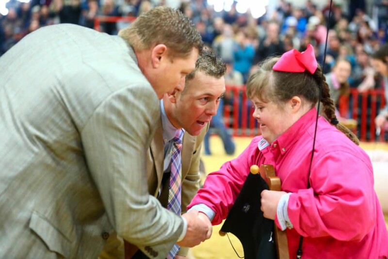 The crowd roared as judges Ryan Sites (left) and Brandon Yantis awarded Samantha Iselt the grand champion barrow overall award at the 2020 San Antonio Stock Show and Rodeo. 