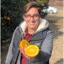 Bianca Kapreilian, CEO and co-founder of Fruit World, Reedly, Calif., with a navel orange.