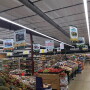 A grocery store produce department with Georgia Grown signage