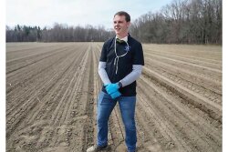 Courtesy Mike Pirrone Produce Inc. Matt DeBlouw, president of Mike Pirrone Produce, checks out a kale field. He expects a strong year for kale and the company’s other crops.