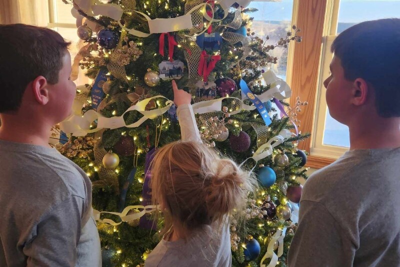 Johnson kids decorating the Christmas tree