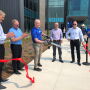 A ribbon-cutting ceremony marked the grand opening of the new Syngenta facility. Warren Kruger, head of field crops seeds development for North America did the honors. With him, from left to right, are Erik Fyrwald, CEO, Syngenta Group; Eric Boeck, regional director North American seeds; Trevor Hohls, global head of seeds development; and Justin Wolfe, president global seeds.