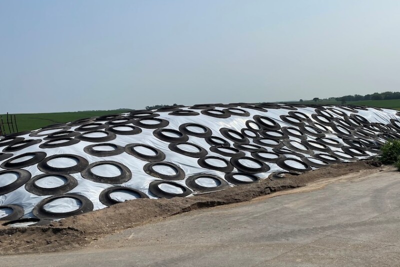 Pictured above is haylage pile that has been properly covered with tires touching, good slop and a sand berm around the base to hold it down and redirect water around the pile when it rains.