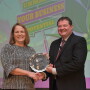 Presented by ARA's Daren Coppock, Kelly Farrell accepts the 2019 Jack Eberspacher Lifetime Achievement Award on behalf of her father, Ron Farrell.
