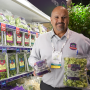 Hundreds of Fresh Summit exhibitors donated food from Fresh Summit expo booths to Florida food banks. Dan Canales of Ippolito International, shows off Royal Brussels sprouts and Brussels sprouts chips.