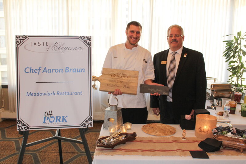 Ohio Pork Council President Dave Shoup presents Chef Aaron Braun with the Chef Par Excellence Award and People's Choice Award. Braun has been awarded the People's Choice Award for two consecutive years.

