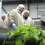 U.S. Agriculture Secretary Sonny Perdue, (foreground), visits with Lef Farms President Henry Huntington at the greenhouse company in Loudon, N.H., in early September during a “Back to Our Roots” RV tour. Perdue and USDA staff are again traveling in an RV this week, with plans to visit Mastronardi Produce in Coldwater, Mich.