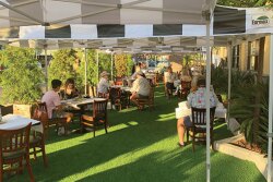 When indoor dining was banned once again in California restaurants due to a surge in coronavirus cases in July, foodservice operators were forced to get creative to keep their businesses afloat. At Milton’s deli in Del Mar, Calif., seven parking spaces in front of the restaurant were covered with artificial turf, and 20 shaded tables were set up, treating diners to al fresco dining. “We’re just trying to make the best of this moving target,” says owner Barry Robbins. “As far as customer experience, it’s been very positive,” he says. “People feel safer outside.”