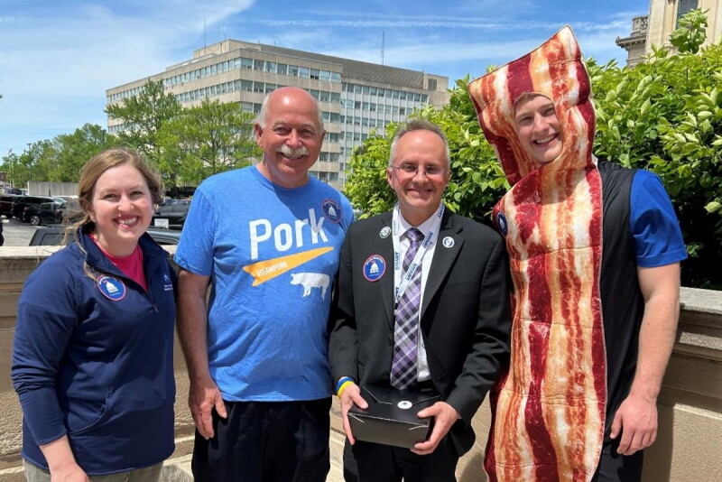 IPPA At-Large Directors, Kristi Smith and Bruce Brinkman, Representative Matt Hanson, and FFA Officer Thaddeus Bergschneider. 
