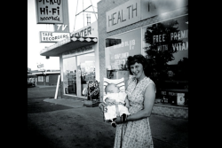o-founder, Margaret Isely outside the first brick and mortar store, circa 1958.