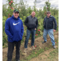 Proprietary Variety Management vice presidents Ryan Brandt and Kevin Brandt meet with PLBARB1 cultivar owner Dennis Barnsby in the Brandt’s Fruit Trees test block on Sept. 30.